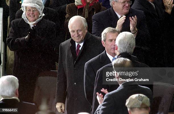 After being sworn in as the 43rd President of the United States George W. Bush shakes the hand of outgoing president Bill Clinton on the West Front...