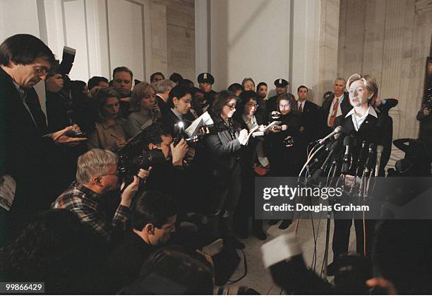 Hillary Clinton, D-N.Y., talks with reporters at a press conference in the Russell Senate Office Building about her brothers accepting money for...