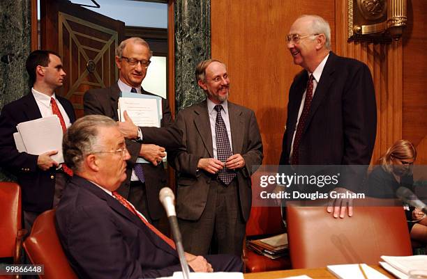 Paul S. Sarbanes, D-MD., talks with Phil Gramm, R-Texas, before the start of the full committee markup on "The International Money Laundering...