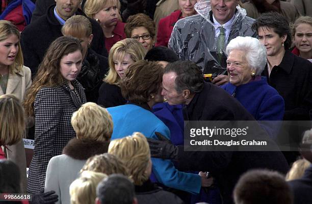 Laura Bush is greeted by her in-laws President George Bush and his wife Barbara as they wait for George W. Bush to be sworn in as the 43rd President...