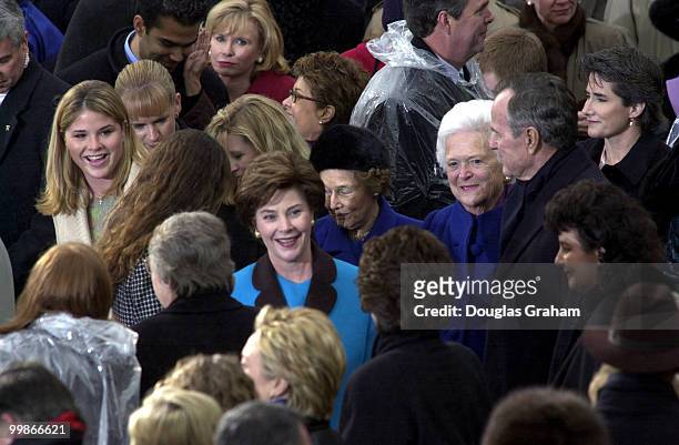 Laura Bush is greeted by members of congress as President George Bush and his wife Barbara look on as they wait for George W. Bush to be sworn in as...