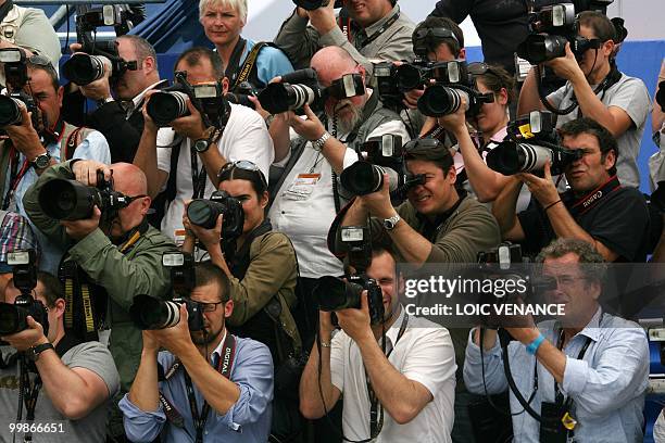 Photographers take pictures during the photocall of "Tamara Drewe" presented out of competition at the 63rd Cannes Film Festival on May 18, 2010 in...