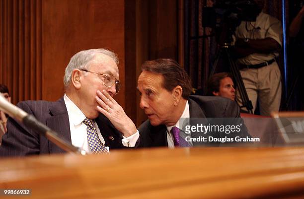 Jesse Helms, R-N.C.,talks with former senator Bob Dole before the start of the confirmation hearing of Daniel Coats to be ambassador to the Federal...