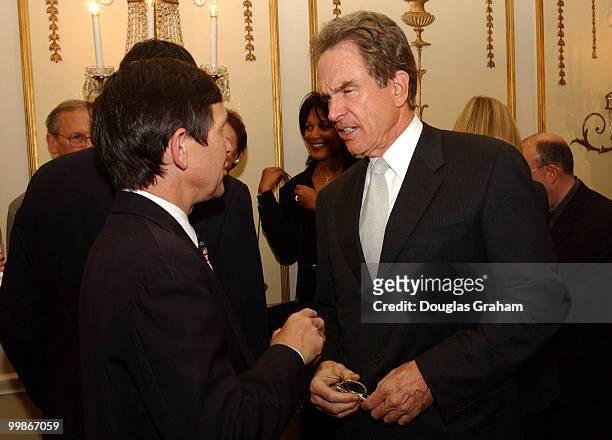 Warren Beatty talks with Dennis J. Kucinich, D-OH., during a reception to kick off the new political group, Progressive Majority.