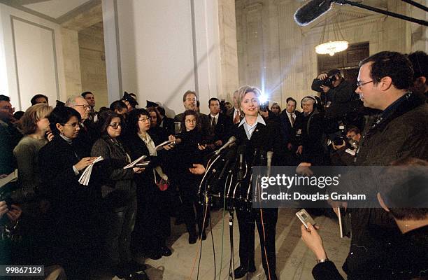 Hillary Clinton, D-N.Y., talks with reporters at a press conference in the Russell Senate Office Building about her brothers accepting money for...