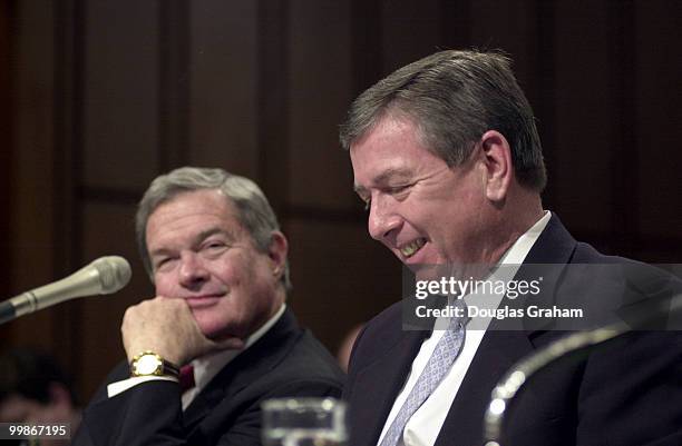 Christopher S. Bond, R-Mo., and John Ashcroft listen to opening statements during Ashcroft's conformation hearing for attorney general before the...