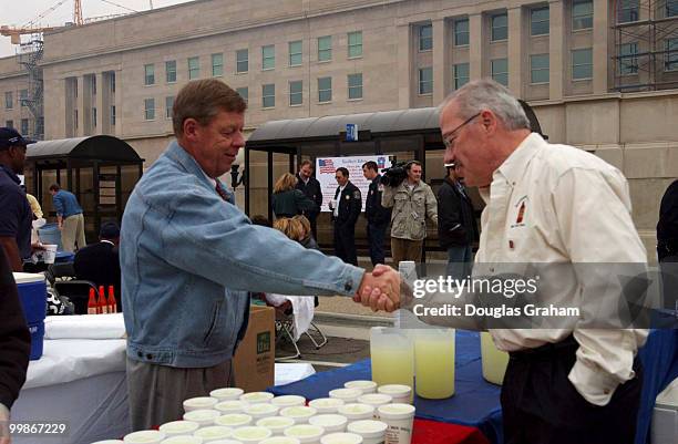 John Isakson, R-Ga., greets Bob Barr, R-Ga., during the Pentagon Renovation Program "Southern Cookout" to salute the men and women who assisted in...