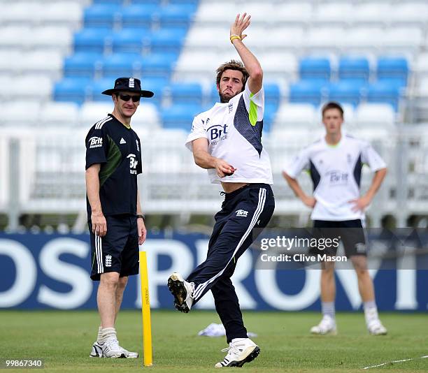 Liam Plunkett of England Lions bowls as bowling coach Kevin Shine looks on during a net session at The County Ground on May 18, 2010 in Derby,...