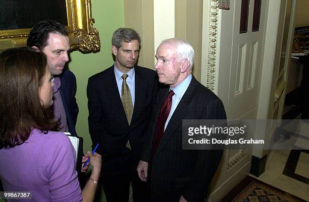 John McCain, R-Ariz., talks with reporters outside the Senate Luncheon about the Hagel Amendment.