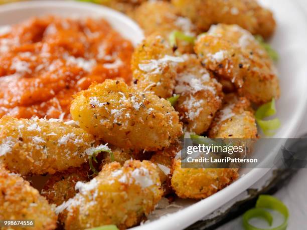 parmesan and herb crusted fried gnocchi - fried dough stock pictures, royalty-free photos & images