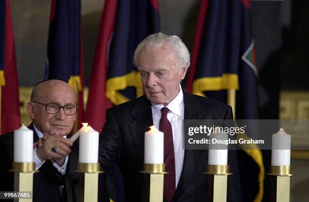 Nathan Shapell, holocaust survivor and Tom Lantos, D-Ca., light a candle during the Memorial Candlelighting at the Holocaust Day of Remembrance in...
