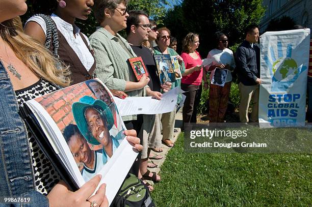 People with Global Aids Alliance and religious leaders hold a prayer vigil in front of the United Methodist Building on Maryland Ave. Next to the...