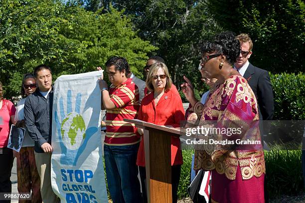 Rev. Carolyn Boyd makes her opening statement with people from Global Aids Alliance and religious leaders during a prayer vigil in front of the...