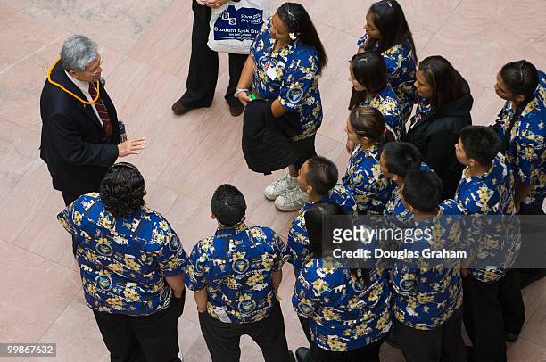 Hawaii Senator Daniel Akaka shares an emotional moment with students from Hilo High School in the Hart atrium yesterday. The students, visiting as...