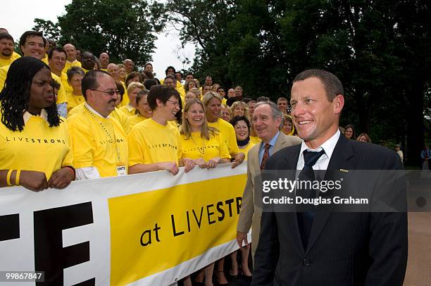 Tom Harkin, D-IA., and Lance Armstrong greets cancer survivors at a press conference to introduce the " Cancer Screening Treatment, and Survivorship...