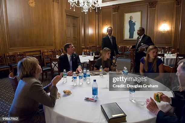 Mark Warner, D-VA., along with his daughters Gillian, Madison, Eliza wife Lisa Collis and father Robert Warner enjoy a private lunch in the Mansfield...