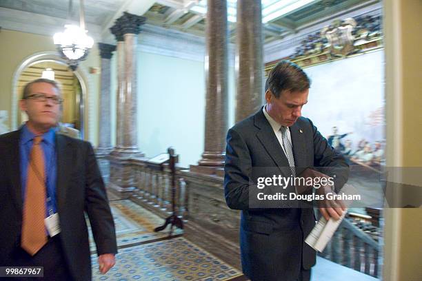 Mark R. Warner, D-VA and Communications Director Kevin Hall rush to a meeting in the U.S. Capitol. May 12, 2009.