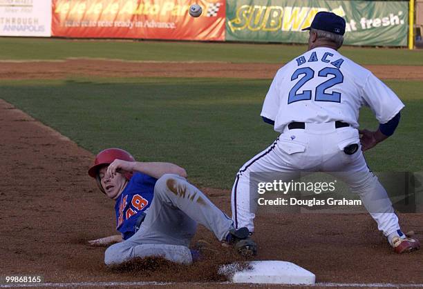 Adam Putnam slides safe into 3rd base safe after Joe Baca droped the ball during the 2004 Congressional Baseball Game.