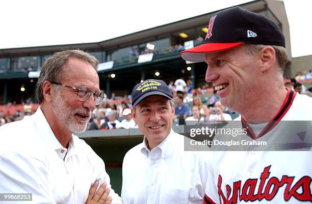 David E. Bonior and Tim Holden talk before the start of the 2003 congressional baseball game.