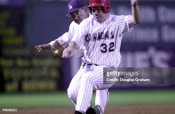 Joe Baca, D-Calif., puts the tag on Tom Davis, R-Va., at thrid base during the Congressional baseball game.