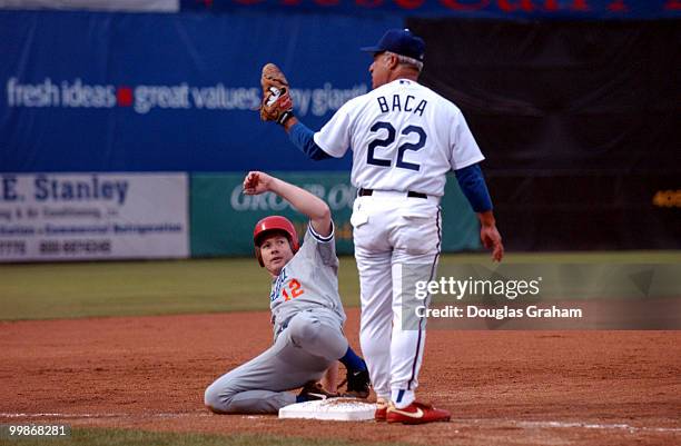 Adam Putnam is safe as Joe Baca checks with the Umpire during the 2003 congressional baseball game.