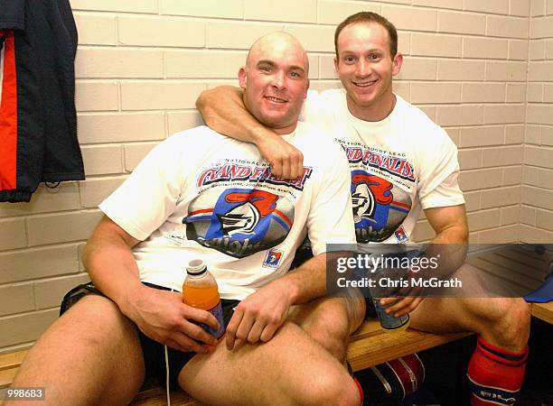 Ben Kennedy and Adam MacDougall of the Knights wear their Grand Finalists T-Shirts after defeating the Sharks during the NRL Preliminary final match...