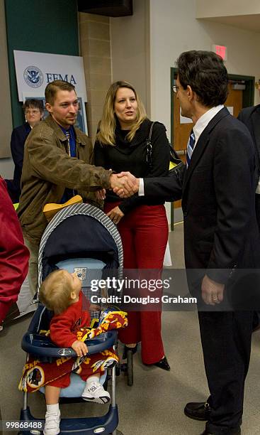 Congressman Eric Cantor, R-VA, talks with Daniel Strickler and Julie Smith as one year old Keagan Strickler looks on at the job fair at the Germanna...