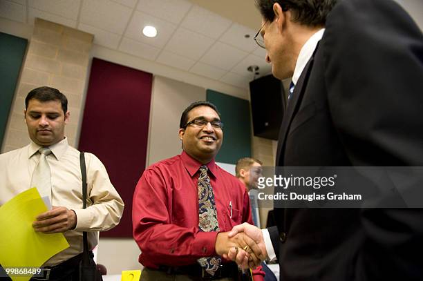 Congressman Eric Cantor, R-VA, talks with people attending the job fair at the Germanna Community College, Daniel Technology Center in Culpeper...