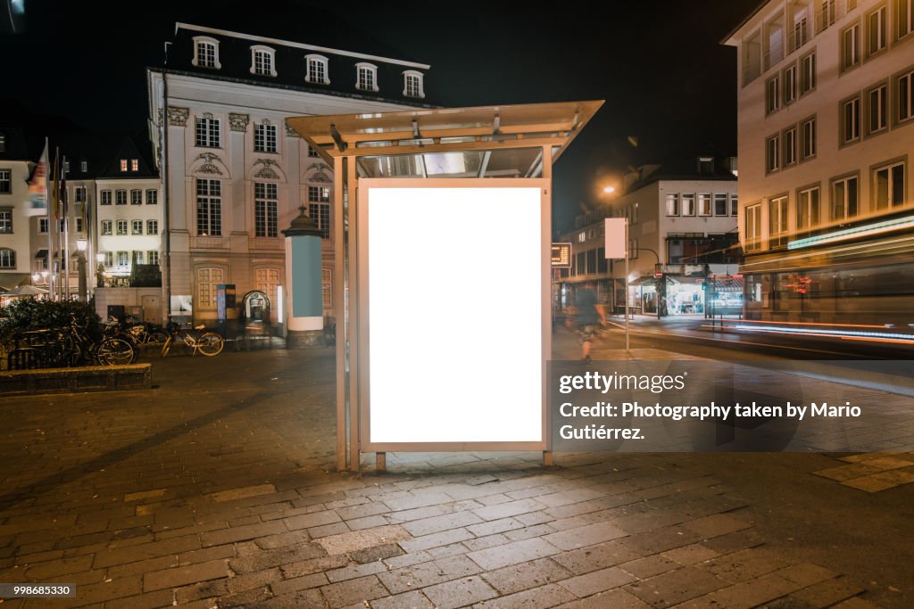 Bus stop with blank billboard