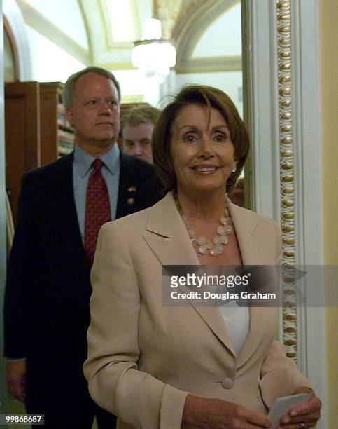 Speaker of the House Nancy Pelosi, D-CA., enters the room with Paul Broun to preform a mock swearing in at the U.S. Capitol. Paul Broun replaces the...