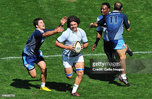 Morne Steyn of the Bulls stretches to tackle team mate Derick Kuhn during a Vodacom Bulls training session at Orlando Stadium on May 18, 2010 in...