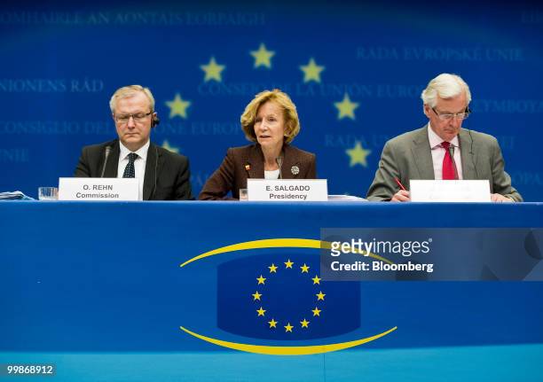 Elena Salgado, Spain's finance minister, center, speaks as Olli Rehn, the European Union's economic and monetary affairs commissioner, left, and...