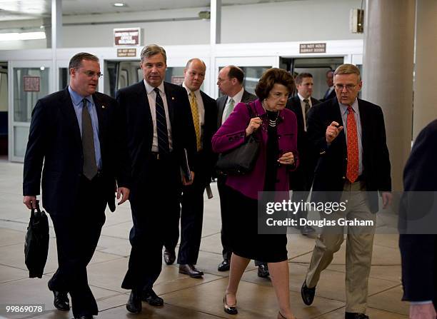 Mark Pryor, D-AR., Sheldon Whitehouse, D-RI., Dianne Feinstein, D-CA., and Byron Dorgan, D-ND., arrive in the Senate subway on their way to the...