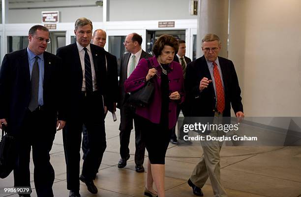 Mark Pryor, D-AR., Sheldon Whitehouse, D-RI., Dianne Feinstein, D-CA., and Byron Dorgan, D-ND., arrive in the Senate subway on their way to the...