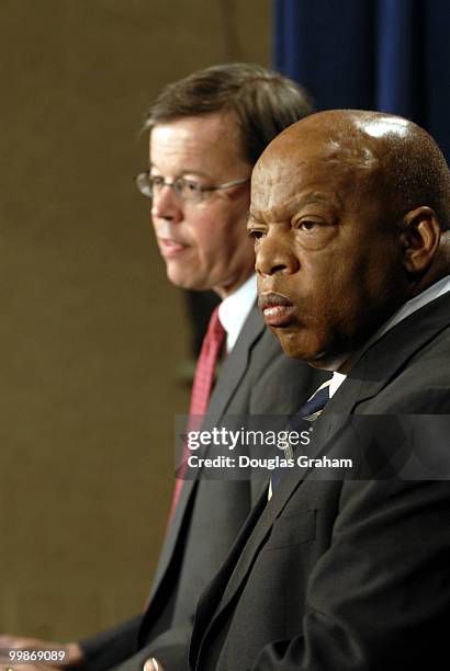 Sen. James Talent, R-Mo., and Rep. John Lewis, D-Ga. During a news conference to unveil a plan to create two new offices in the Justice Department to...