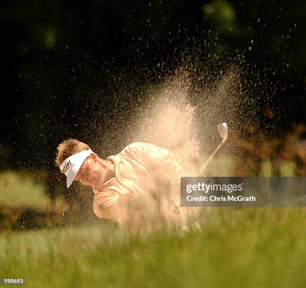 Stuart Appleby of Australia hits out of the bunker on the 5th hole during the third round of the Holden Australian Open Golf Tournament held at The...