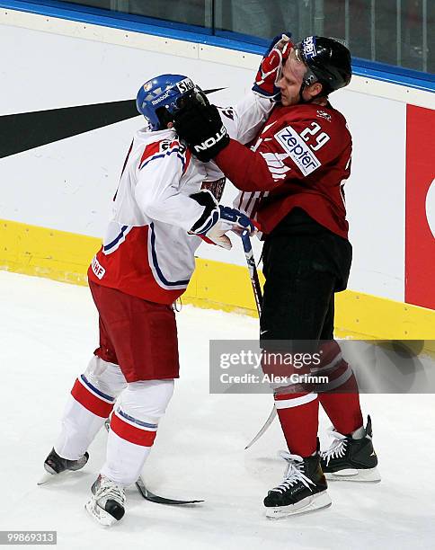 Tomas Rolinek of Czech Republic fights with Steven Ott of Canada during the IIHF World Championship group F qualification round match between Canada...