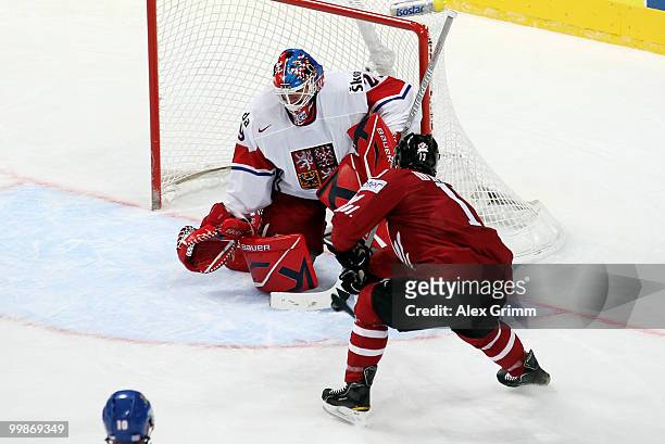 Ray Whitney of Canada scores his team's first goal against goalkeeper Tomas Vokoun of Czech Republic during the IIHF World Championship group F...