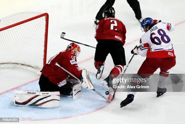 Jaromir Jagr of Czech Republic tries to score against Kris Russell and goalkeeper Chris Mason of Canada during the IIHF World Championship group F...