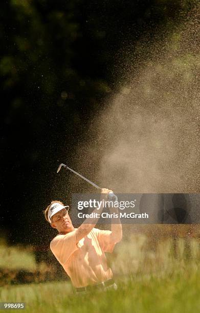Stuart Appleby of Australia hits out of the bunker on the 5th hole during the third round of the Holden Australian Open Golf Tournament held at The...