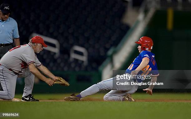 Tim Bishop, D-NY, tags Adam Putnam, R-FLA., out at 3rd base during the 48th Annual Roll Call Congressional Baseball Game on June 17, 2009 at...