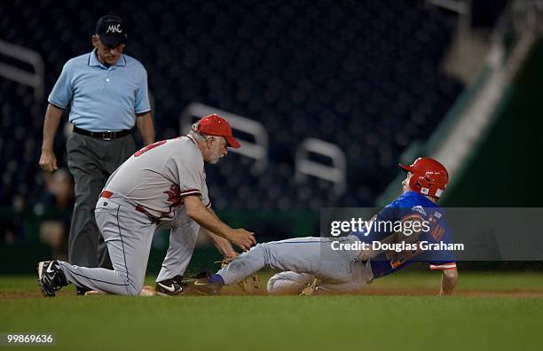 Tim Bishop, D-NY, tags Adam Putnam, R-FLA., out at 3rd base during the 48th Annual Roll Call Congressional Baseball Game on June 17, 2009 at...