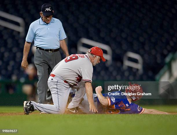 Tim Bishop, D-NY, tags Adam Putnam, R-FLA., out at 3rd base during the 48th Annual Roll Call Congressional Baseball Game on June 17, 2009 at...