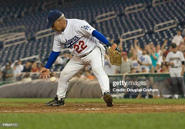 Joe Baca, D-CA., deals with a loose ball during the 47th Annual Roll Call Congressional Baseball Game at Nationals Park in Washington, D.C. On July...