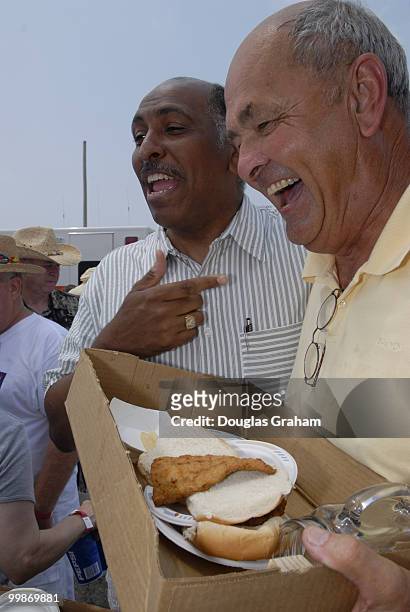 Michael Steele has a laugh with Donnie Drewer during the 30th annual J. Millard Tawes Crab and Clam Bake in Crisfield Maryland.
