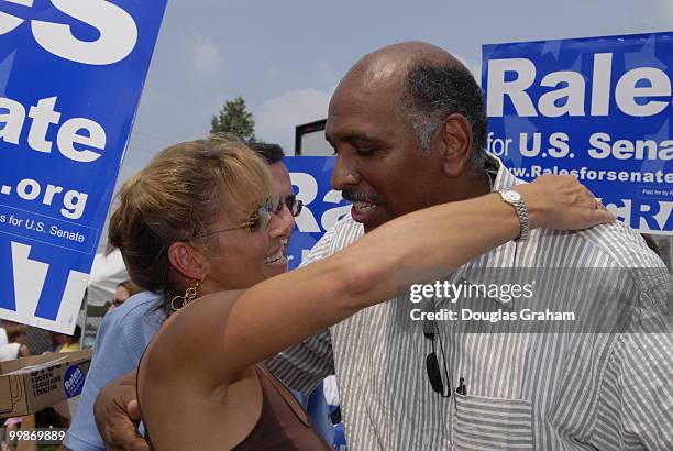 Debby Rales and Michael Steele enjoy a laugh during the 30th annual J. Millard Tawes Crab and Clam Bake in Crisfield Maryland.