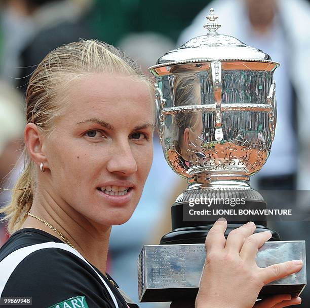 Russia's Svetlana Kuznetsova holds up the trophy after winning against Russia's Dinara Safina during a French Open tennis final match on June 6, 2009...