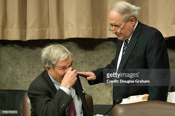 Kit Bond, R-MO., and Carl Levin, D-MI., talk before the start of the full committee hearing on the nomination of Leon Panetta to be director of the...