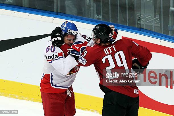 Tomas Rolinek of Czech Republic fights with Steven Ott of Canada during the IIHF World Championship group F qualification round match between Canada...
