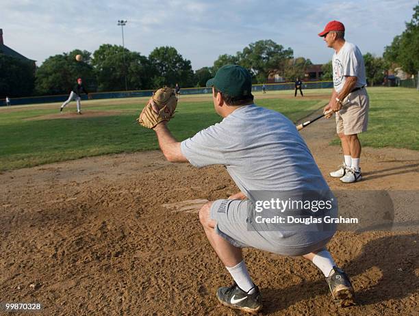 Freshmen Bruce Braley, D-IA., pitching to Freshmen Chris Carney, D-PA., during a practice for the democratic baseball team.